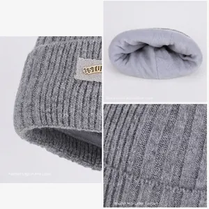 Men's winter knit beanie with warm fleece lining and STUDIO label for outdoor cold weather