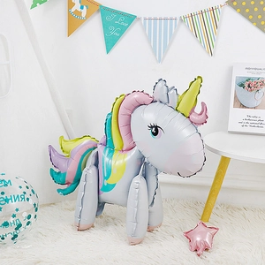 Detailed close-up of a 3D standing unicorn foil balloon with rainbow mane and golden horn