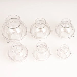 Set of six spherical DIY candle molds in various sizes on a clean white background