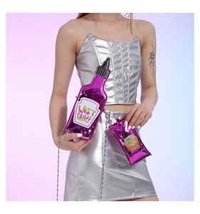 Detail view of purple sauce bottle crossbody bag with silver chain and artistic text print