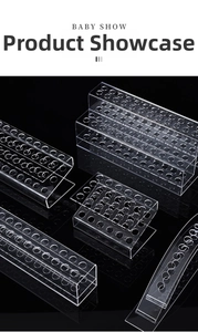 Multiple styles of clear acrylic display stands for pens and makeup brushes on black background