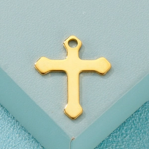 Gold minimalist stainless steel cross pendant displayed on a light blue background