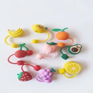 Assorted colorful silicone fruit straw covers set with dust-proof caps on white background