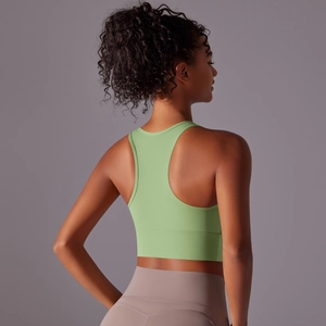 Rear view showing racerback cut and seamless texture of green sports bra yoga top
