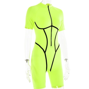 Detail of neon green short sleeve bodysuit featuring black front zipper and trim