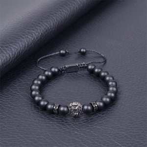 Men's matte black beaded lion head bracelet with adjustable braided rope closure