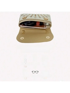 Macro view of crystal and pearl evening bag interior with dual magnetic closure