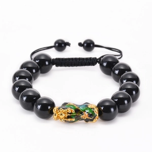 Detail of Pixiu obsidian bracelet with colorful enamel charm and adjustable cord