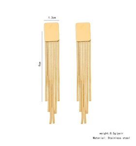 Detail showing long golden stainless steel tassel earrings with dimensions on white background