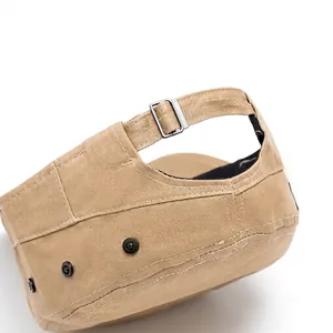 Adjustable khaki flat cap with silver metal buckle and black rivet details in cotton twill