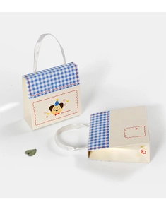 Detail of cream gift box with blue checkered lid and white silk handle for candies