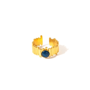 Detail of 18K gold-plated ring featuring a round blue natural stone and striped texture