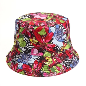 Detail of tropical floral and zebra print fabric on a reversible wide-brim sun bucket hat