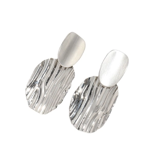Minimalist silver geometric earrings with frosted and wavy polished metal finish