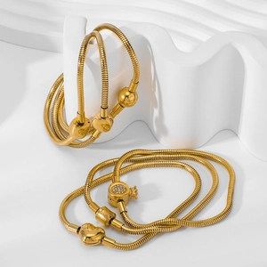 18K gold plated titanium snake bone chain bracelet with DIY charms on white display