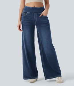 Detail der hohen Taille und der dunkelblauen Vintage-Waschung der Damen-Jeans