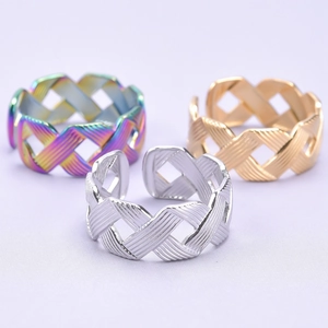 Adjustable woven cross ring set in iridescent, gold, and silver stainless steel