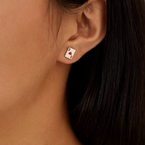 Minimalist stainless steel Ace of Hearts playing card stud earrings worn by a model