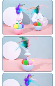 Detail of tumbler cat toy featuring colorful feathers and plush balls on a macaron base