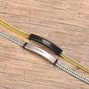 Detail of custom curved metal plates on woven bracelets in gold and silver finish