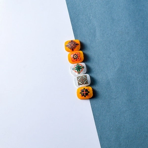 Retro 5D embossed nail stickers with bohemian mandala patterns in white and amber