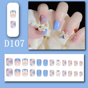 Detail of short square press-on nails D107 with 3D white bow and heart patterns