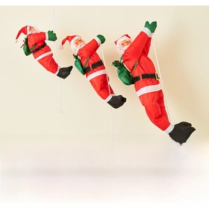 Detailed view of three Santa Claus climbing ropes figures for festive wall decoration