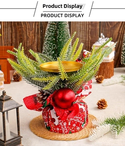 Macro shot of Christmas candle holder with pine cones and Merry Christmas fabric base