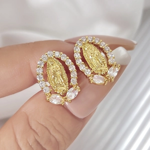 Detail of 18K gold Virgin Mary earrings with micro-pave marquise and round cubic zirconia