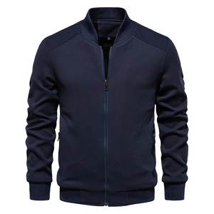 Detailed view of the navy blue jacket with honeycomb texture and ribbed stand collar