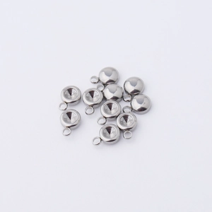 Detail of silver stainless steel round hollow pendant charms for birthstone settings