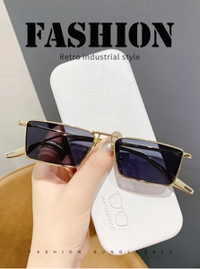 Detail of vintage gold metal square sunglasses with premium white leather protective case