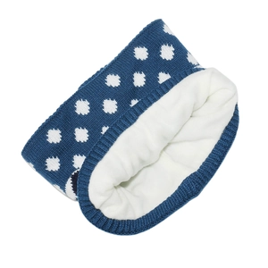 Detail of navy knit neck warmer with white polka dots and thick white fleece lining