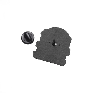 Detailed back view of a black metal badge featuring a secure rubber clutch and textured finish