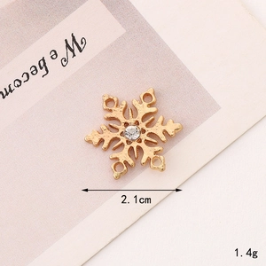 Golden snowflake charm with center rhinestone for DIY jewelry making and necklaces