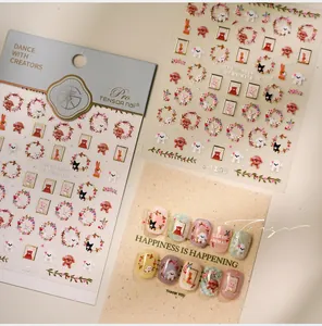 Detail of floral animal nail decals featuring golden frames and cute puppies and rabbits
