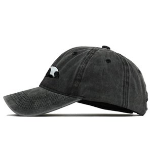Detailed view of the panda embroidery on the washed grey cotton baseball cap fabric