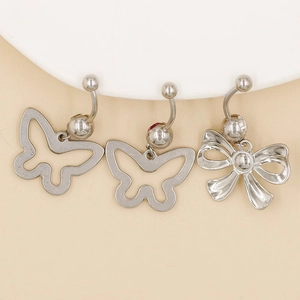 Detailed close-up of three silver stainless steel bow and butterfly navel piercing rings
