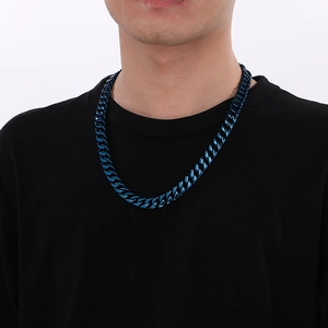 Male model wearing 12mm blue Cuban link chain necklace in polished stainless steel