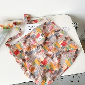 Detail of canvas tote bag with urban oil painting print and decorative tulips