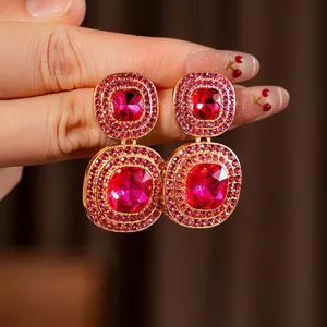 Vintage style square gold earrings with red pavé crystals in a retro palace design