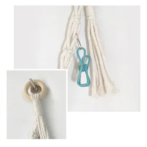 Handmade cotton rope organizer with natural wooden ring and blue hook for storage