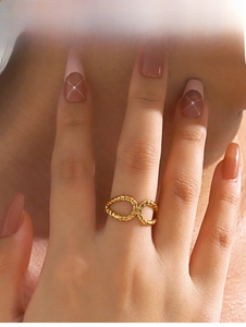 Detail shot of a golden braided twist ring featuring an elegant double loop design