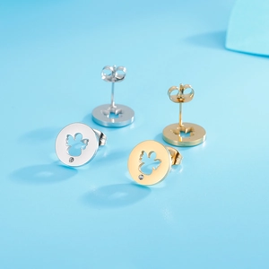 Detailed view of hollow angel stud earrings in gold and silver finish with small zircon stones
