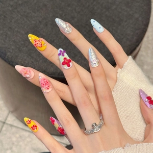 Handmade 3D floral press-on nails featuring yellow hand-painted flowers and 3D roses