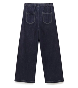 Detail of dark blue denim wide-leg pants featuring elastic waistband and rear pockets