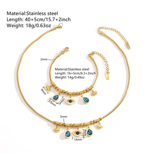 Parure collier et bracelet en acier doré avec pendentifs œil bleu et pierres fines