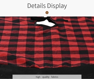 Detail of red and black buffalo plaid Christmas tree skirt with black ribbon ties