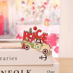 Detail of wooden Christmas truck ornament with PEACE letters and red bead hanging string