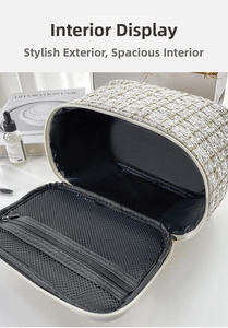 Detail of tweed makeup bag interior with large compartment and mesh zipper pocket